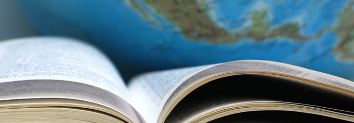 Book in Front of Globe