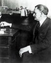 Michelson using a spectrograph to test a diffraction grating, Ryerson Physical Laboratory, University of Chicago, circa 1920. [646K]