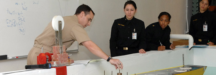 Midshipmen test a model in a lab