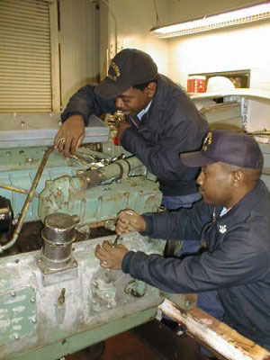 Mechanics working on engine